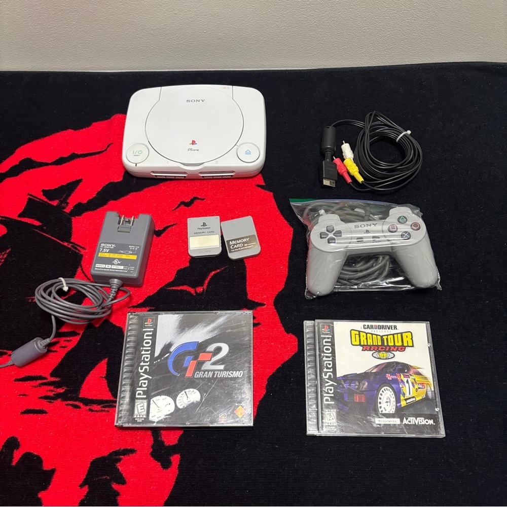 Sony PlayStation Console with White and Gray Controller